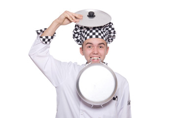 Young chef holding pan isolated on white