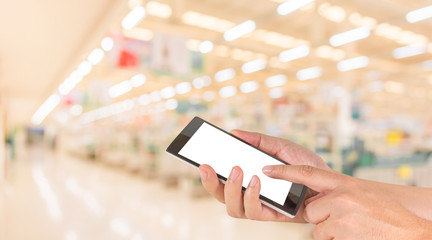 male hand is holding a modern touch screen phone and blurred ima