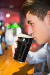 Man with drinking at bar counter