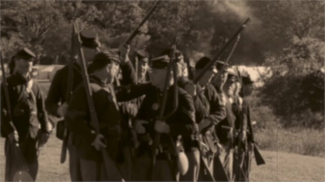 Vintage combatants firing arms