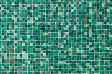 graphic, abstract image of green and red wall tiles