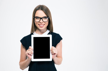 Fototapeta premium Smiling woman showing blank tablet computer screen