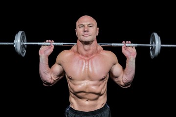 Portrait of confident man lifting crossfit