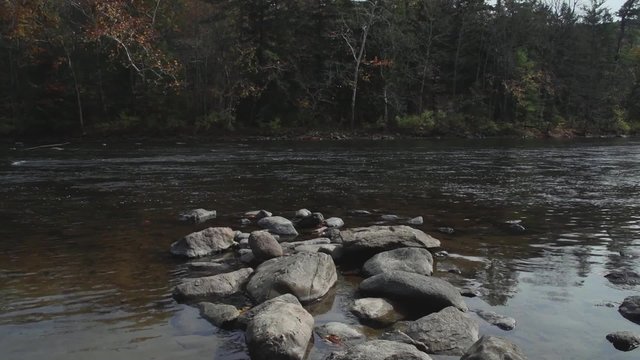 Scenic view of rock-lined river