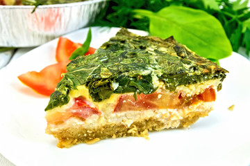 Pie celtic with spinach in  white plate on table