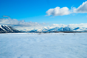 View over snowy mountains in Svalbard, Arctic © dinozzaver