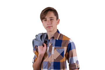 Portrait of attractive teen boy being photographed in a studio. Isolated on white background