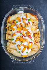 Pancakes with cottage cheese and peach doused sour cream