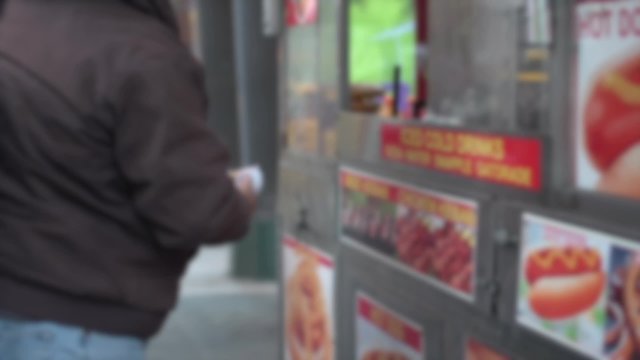 Eating at a New York City food stand