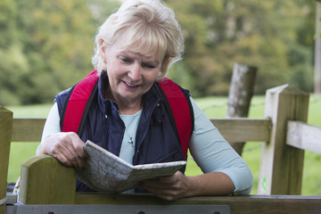 Active Senior Woman On Walk In Countryside