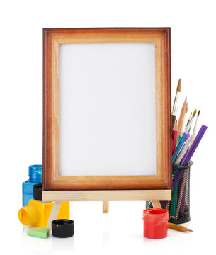 paint supplies and frame isolated on white