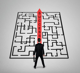 Business man thinking Success word maze