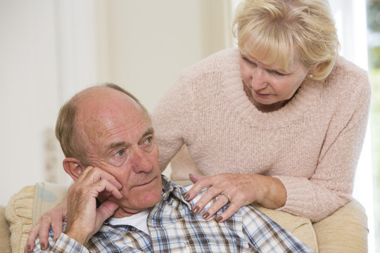 Woman Comforting Senior Man With Depression