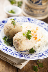 Ham and herbs dumplings with sauerkraut