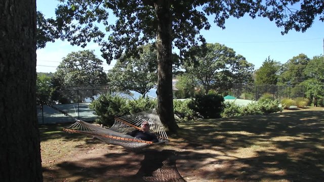 Man relaxing on a hammock