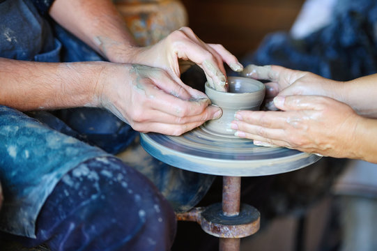 Artisan teaches how to work on a potter's wheel