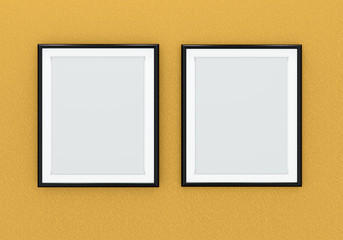 Two black picture frames over orange wall