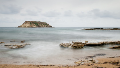 Fototapeta na wymiar Rocky Seascape with the island of geronisos