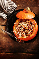 Tasty autumn country dinner of stuffed pumpkin