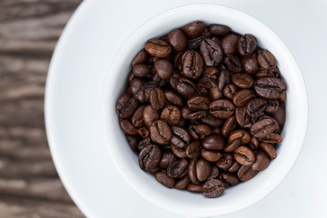 Fototapeta premium Coffee beans in cup