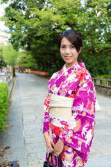 Fototapeta premium Woman with japanese traditional clothing at street