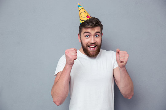 Portrait Of A Cheerful Man With Birthday Hat