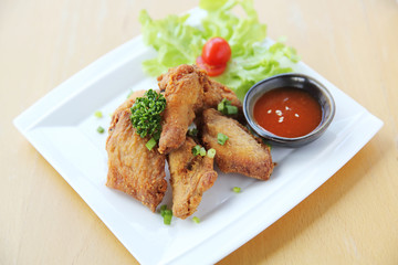 Fried chicken on wood background