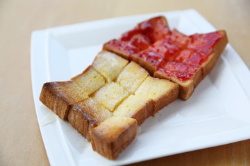 grilled bread with starwberry jam and milk