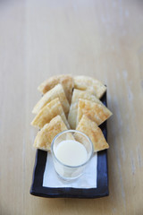 roti with milk on wood background