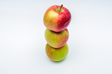 Three red yellow green apples isolated