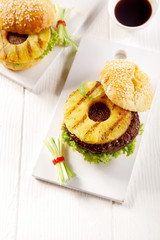 Two Tasty Hawaiian Burgers on White Plate