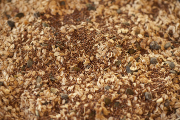 Healthy breakfast. Granola with nuts, seeds, honey, frozen raspberries pumpkin in a wooden biwk on wooden table