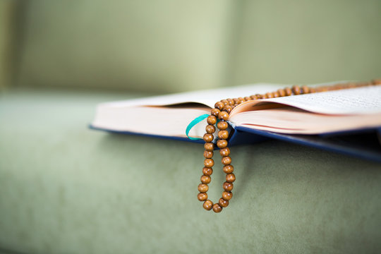 The Koran with rosary beads