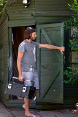 man carrying toolbox