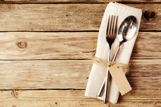 Spoon and Fork Tied on White Napkin with Tag