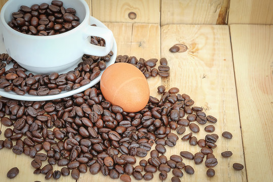 coffee bean and egg on the wood floor