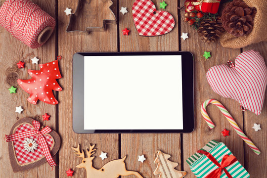 Digital tablet mock up with rustic Christmas decorations for app presentation