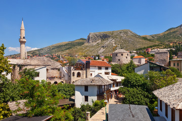 Fototapeta na wymiar View at the Old Town in Mostar with Minaret. Bosnia and Herzegovina.