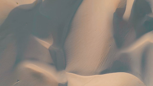 Top down view of animal footprints on dune in the arabian desert