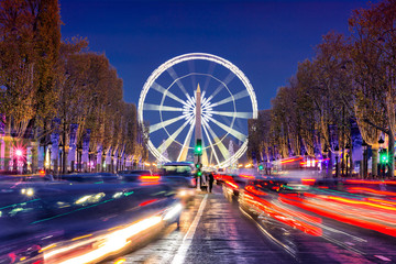 Avenue des Champs-Elysees with Christmas lighting leading up to the Grande Roue (Big Wheel) in...