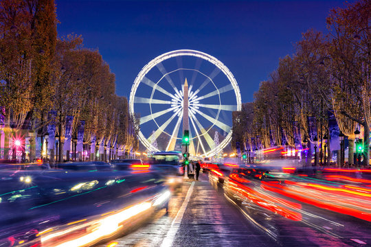 Avenue des Champs-Elysees with Christmas lighting leading up to the Grande Roue (Big Wheel) in Paris, France