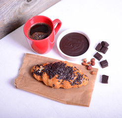 Chocolate croissant on white background
