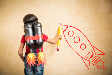 Kid playing with jet pack at home