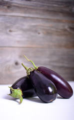 Eggplant on white wood background