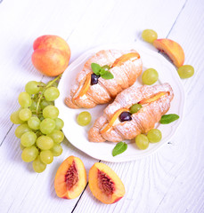 Fresh fruit croissant on white background