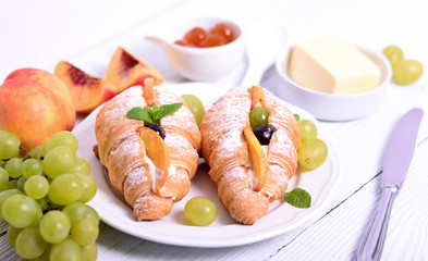 Fresh fruit croissant on white background