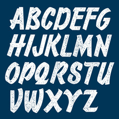 Retro handmade script font. Stamped woodprinted letters.