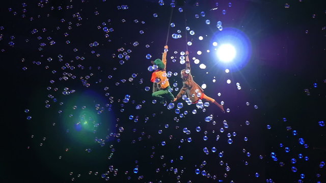 Child Aerial Performers Spinning in Air