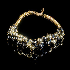 necklace on a black background
