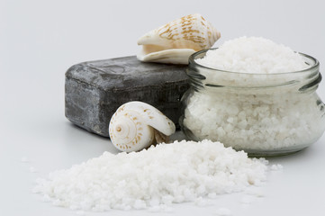Natural Dead Sea salt with handmade mud soap isolated on white background